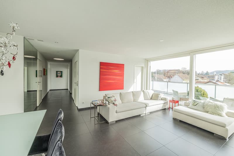modern design, white walls, large windows, white couches, glass table, black floor