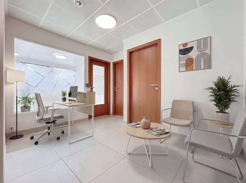 modern office room with white tiles, desk, office chair, wooden table, chairs, plants, lamps, picture frame