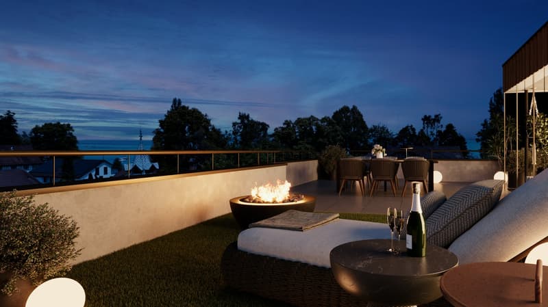 Outdoor terrace with a fire pit, a sofa, a dining table, and a view of the city at night