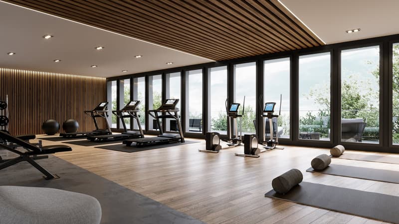 Well-equipped gym with treadmills, a rowing machine, yoga mats, and weights