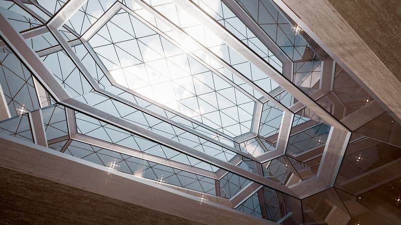 Atrium with geometric skylight pattern, reflecting sunlight, modern architecture