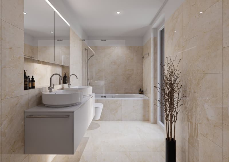 modern bathroom with beige tiles, double sink, bathtub, toilet, and a large mirror