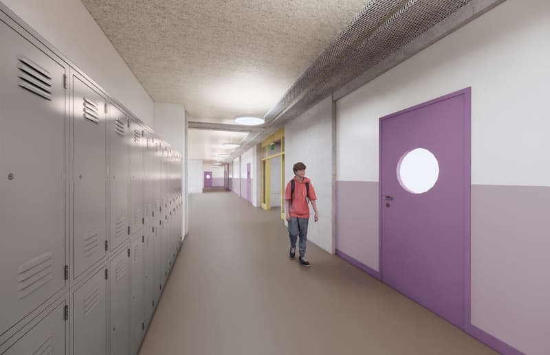 corridor with lockers and circular window, a student walking