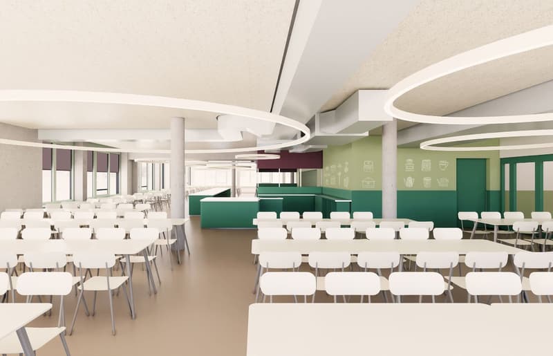 An artist's rendering of a modern and empty cafeteria space. The room is dominated by white tables and chairs arranged neatly in rows, creating a functional and orderly layout. The ceiling features a series of large, circular white lights that hang from i