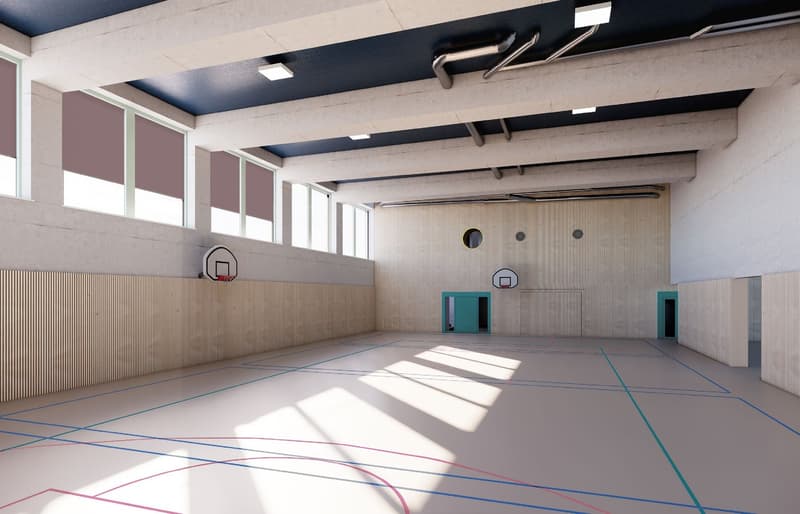 large open space with hardwood floor, basketball hoops, two doors on the right side, windows on the wall