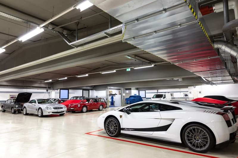 underground parking, multiple cars parked, maintenance area, covered areas, ceiling lights
