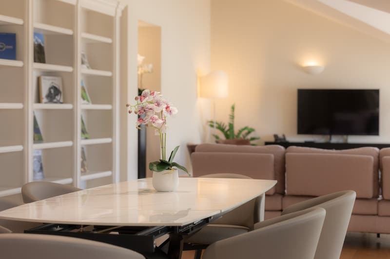 table, flowers, chairs, couch, television