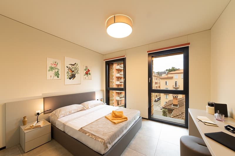 bedroom, bed, nightstands, lamp, desk, large window, balcony, book, vase, decorative painting