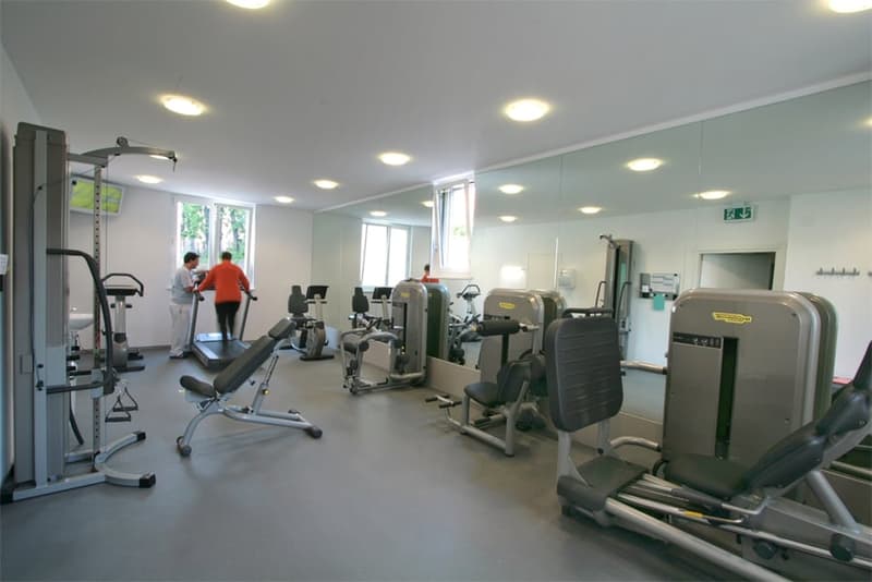 gym with various exercise machines, windows