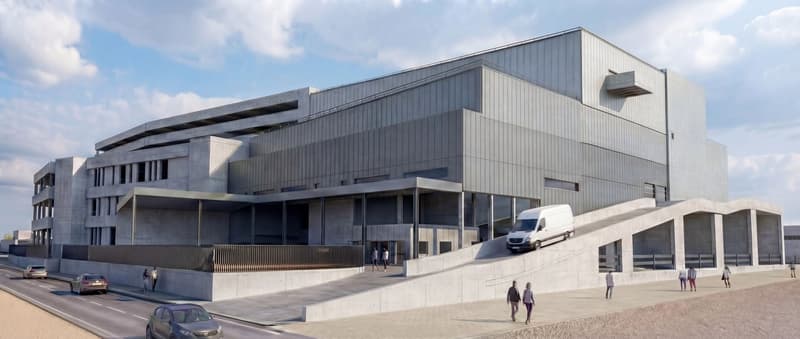 2 story building, gray walls, gray roof, balcony, paved sidewalks, parking ramp, entrance ramp