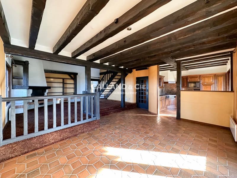 beamed ceiling, fireplace, wooden flooring, kitchen area, staircase
