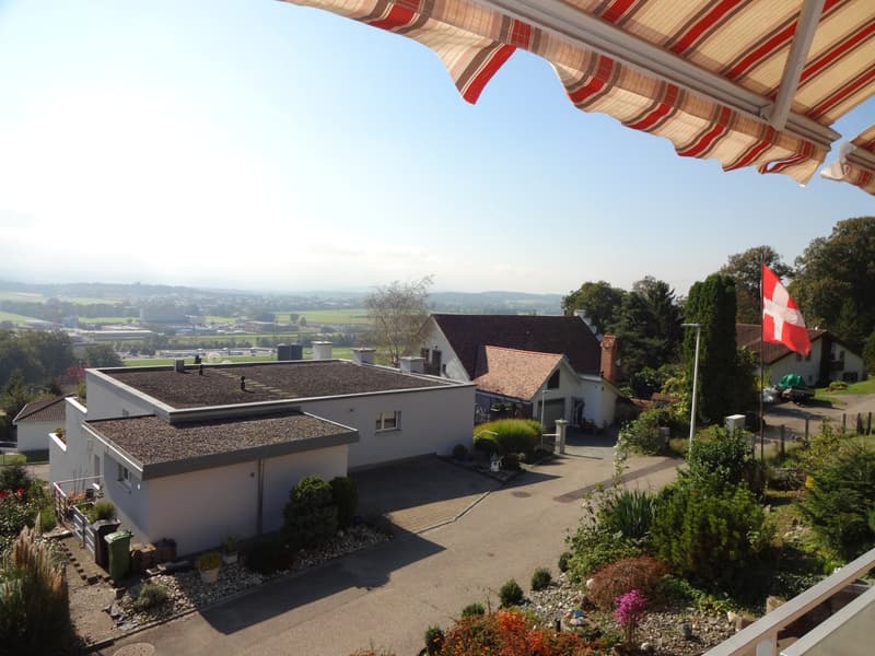 House: two white single-family homes, gravel driveway, large garden, distant view of the countryside