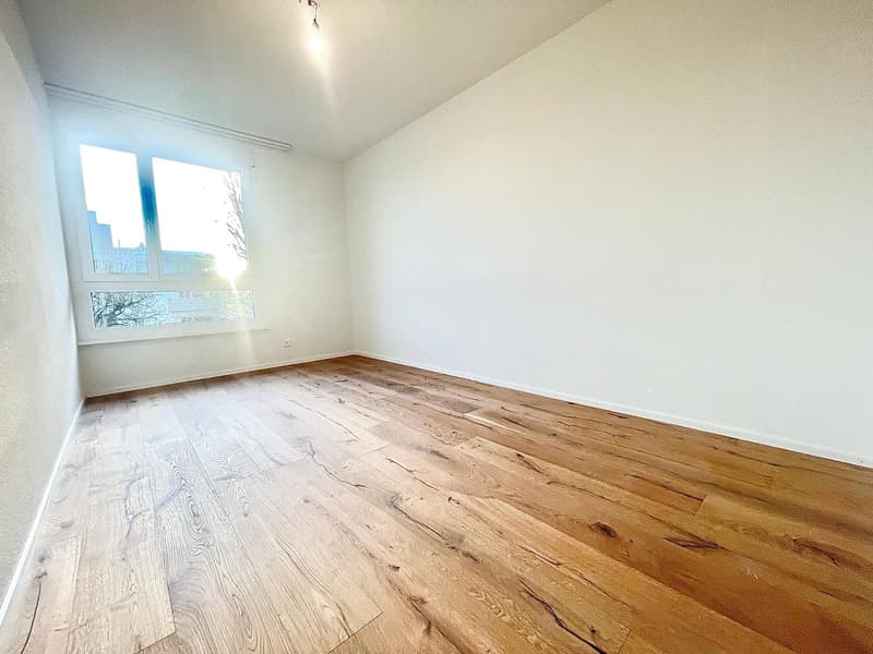 empty room, hardwood floors, white walls, large window, natural light