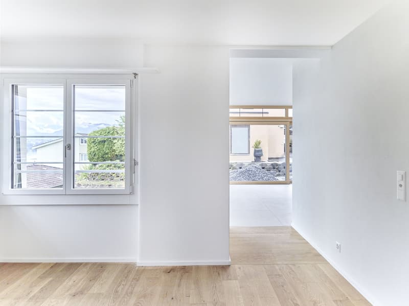 Wohnzimmer mit Zugang zur Küche