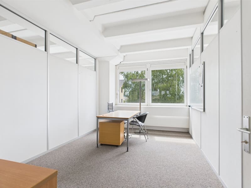 white walls, wooden desk, office chairs, glass window, whiteboard