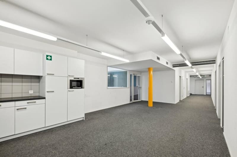 empty room, modern style, white cabinets, grey flooring, bright lights