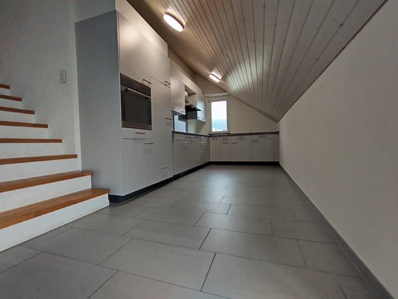 empty room, gray tiles, white walls, wooden staircase, white cabinets, oven, window
