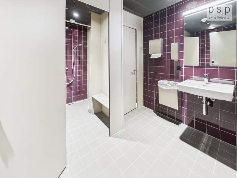 modern bathroom with purple tiles, walk-in shower, bench, sink, mirror, white fixtures