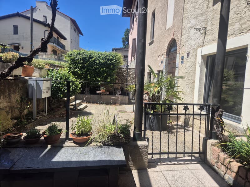 Casa di 3,5 locali con giardino, a 5 minuti da Lugano (1)