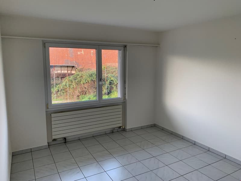 empty room, white walls, window, tile floor, radiator