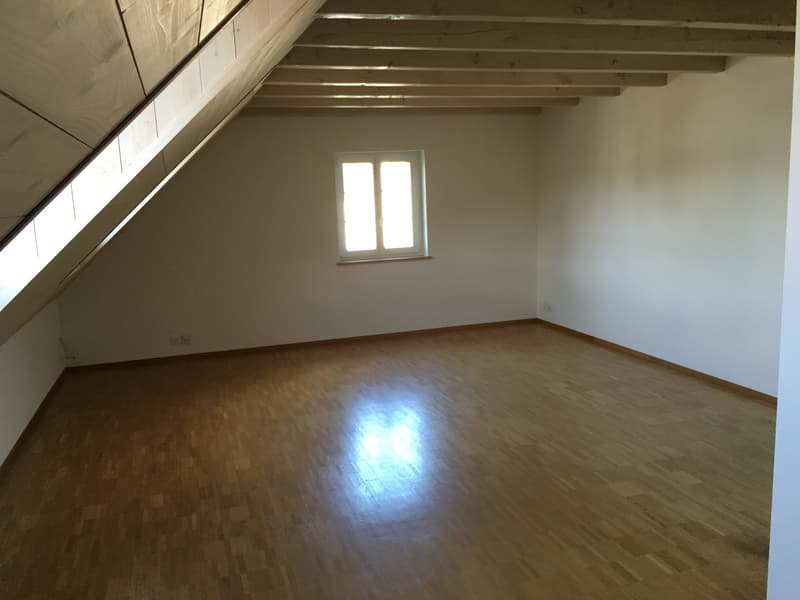 empty room, wooden floor, white walls, window, slanted ceiling