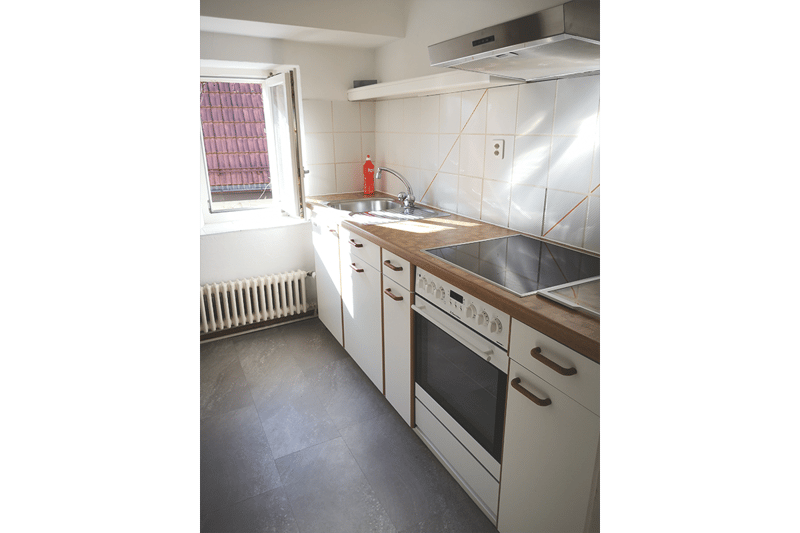 kitchen with sink, oven and refrigerator
