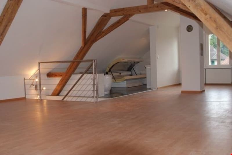 Wooden beams, wooden flooring, staircase, wall mounted lamp, empty room, small window