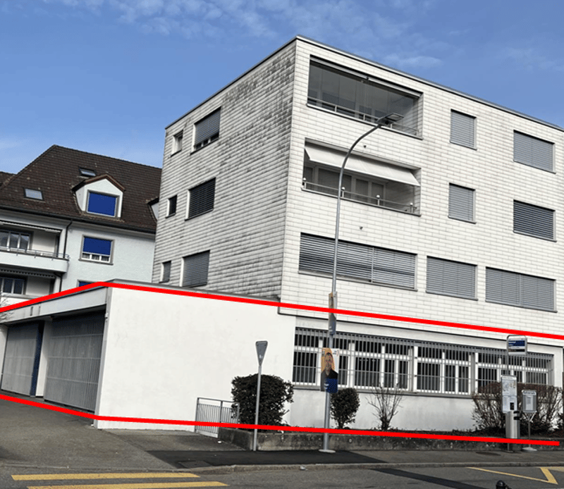 multi-story building, white walls, glass windows, streetlight, garage