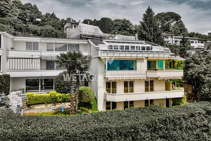 Appartement triplex élégant à Porza avec vue sur le lac, jardin privé, piscine et sauna communs à vendre (2)