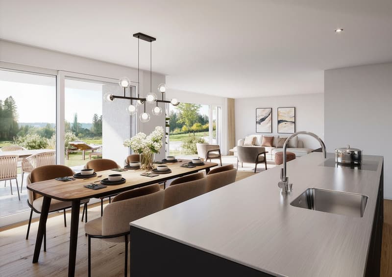 Spacious open-plan living and dining area with large windows offering a scenic view of the outdoor landscape. The dining table seats 8 people, with modern pendant lighting fixtures overhead. The living room features a comfortable sofa and armchairs, along