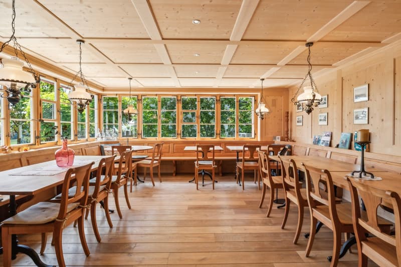 dining area with large windows overlooking the outside