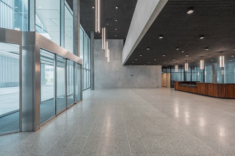 modern design, large windows, modern chandeliers, marble flooring