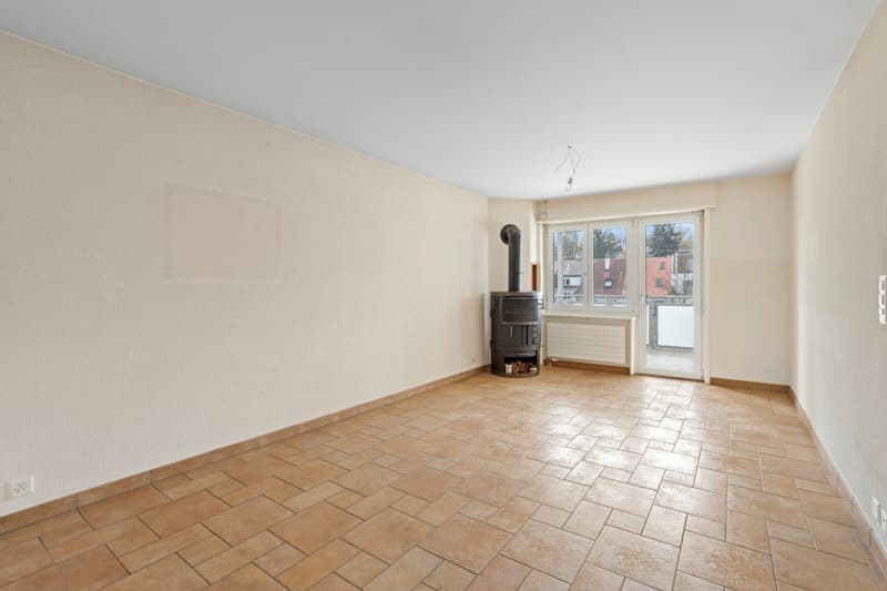 empty room, tiled floor, white walls, fireplace, sliding glass door, balcony