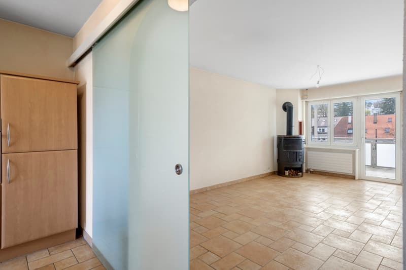 empty room, fireplace, sliding glass door, wooden cabinet, tiled floor, glass door