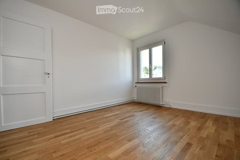 empty room, white walls, wooden floors, white door, white window with white window sill