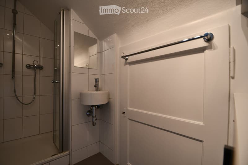 white tiles, shower, sink, mirror