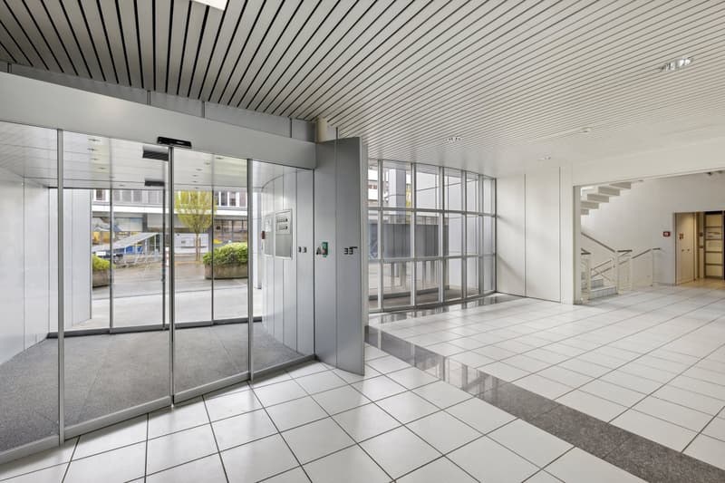 tiled floor, glass doors, glass walls, open elevator