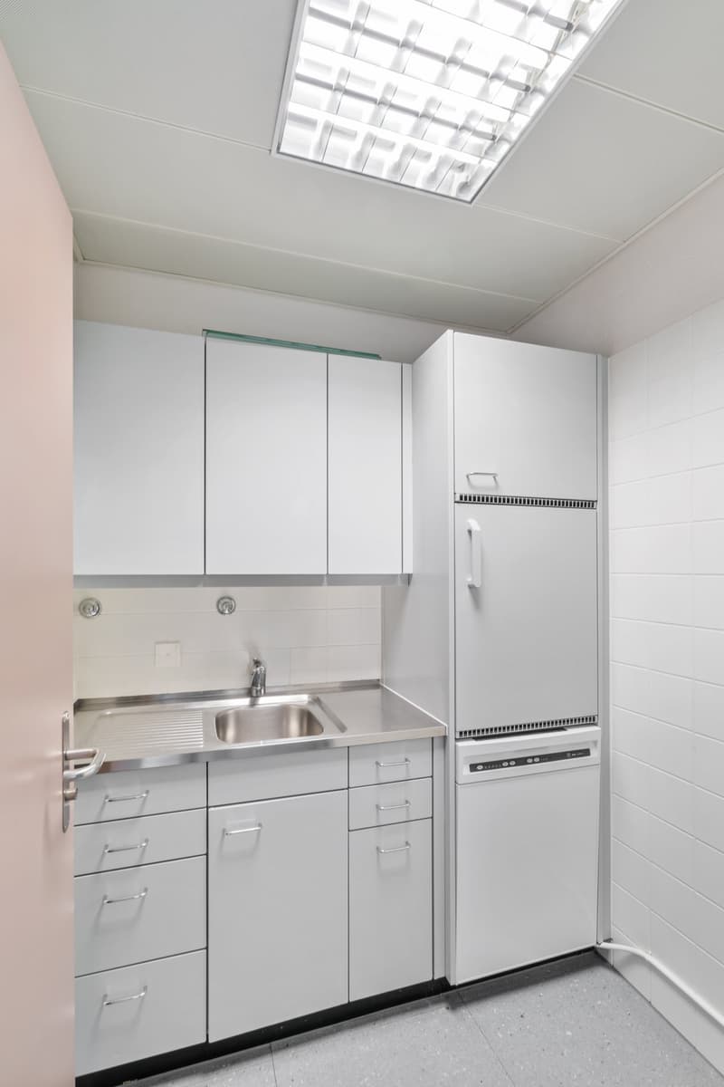 white cabinets, stainless steel counter top, sink, white fridge, dishwasher