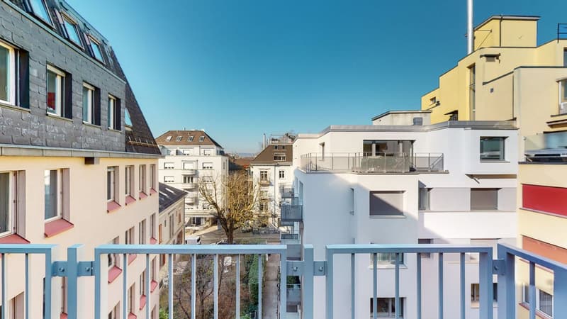 Balcony, multiple buildings, balconies, windows, view of trees and road