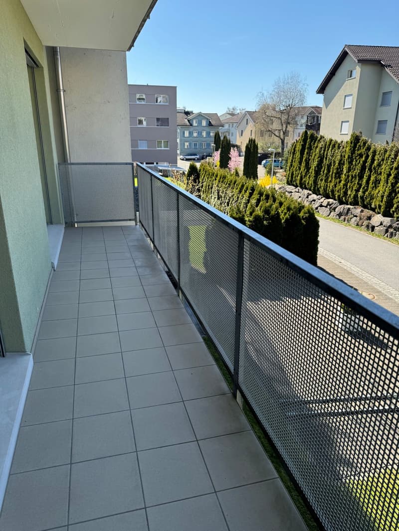 tiled floor, metal railing, view of the street