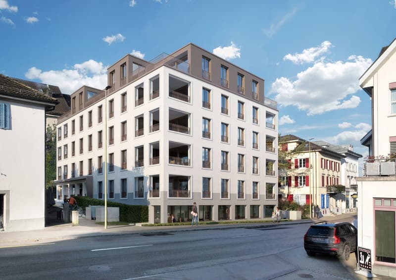 6-story building, white and grey, large windows, balconies