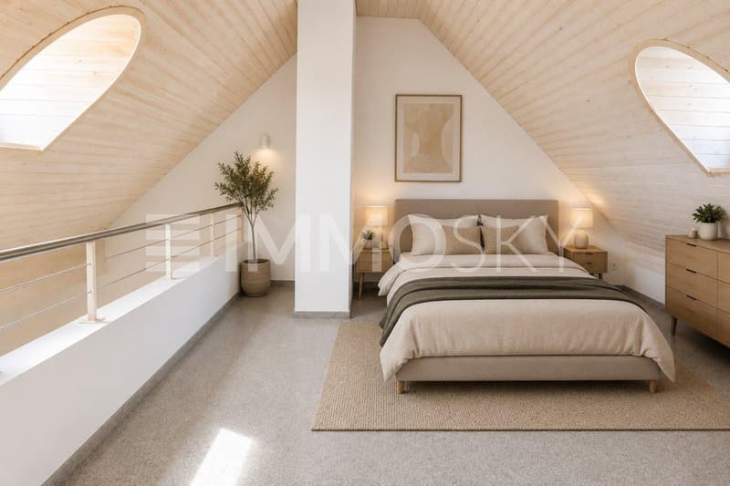 Heimeliges Schlafzimmer mit Dachfenster