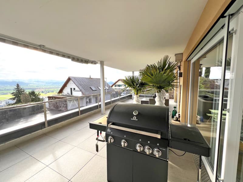 outdoor grill on balcony with tiled flooring, panoramic view of the mountains
