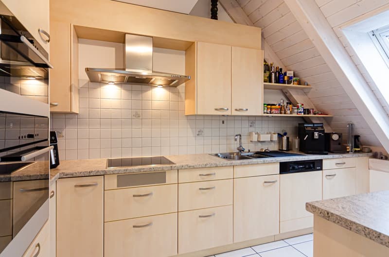 wooden cabinets, granite countertops, kitchen island, stainless steel appliances, dishwasher, gas stove