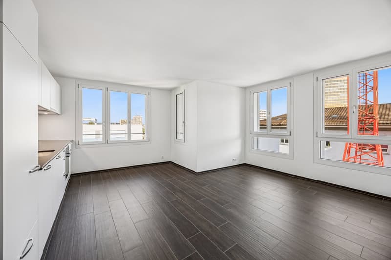 empty kitchen, white walls, white ceiling, wooden floor, large windows