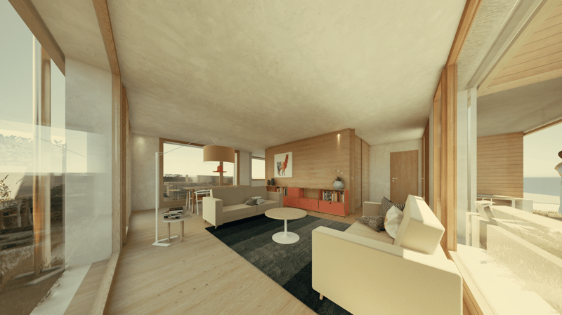 Open-concept living room with large windows, wooden floors, white walls, modern furniture including a sofa, coffee table, and shelving unit, and a balcony or terrace visible through the windows.