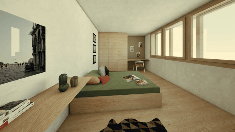 Spacious bedroom with wooden flooring, large windows, a built-in bed platform with green bedding, and decorative accents such as framed artwork and cushions. The room has a minimalist and modern design aesthetic.