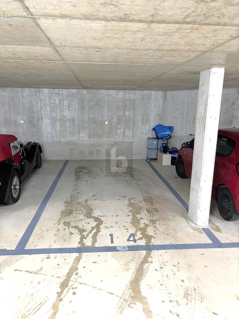 PARKING NEUF EN SOUS-SOL AU CUR DU VILLAGE ! (1)
