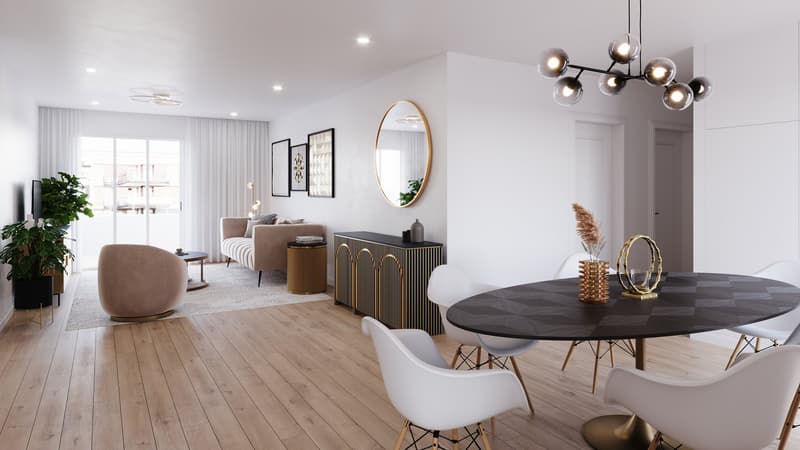 Dining and living area with wooden floor, large windows, modern furniture, white walls, central round table, wall-mounted mirror, side table, plant, couch with pillows