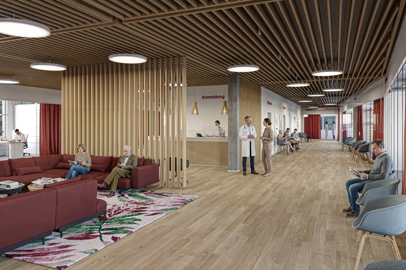 large room, wooden floor, wooden ceiling, large windows, red curtains, reception desk, people sitting on chairs, people standing, people reading